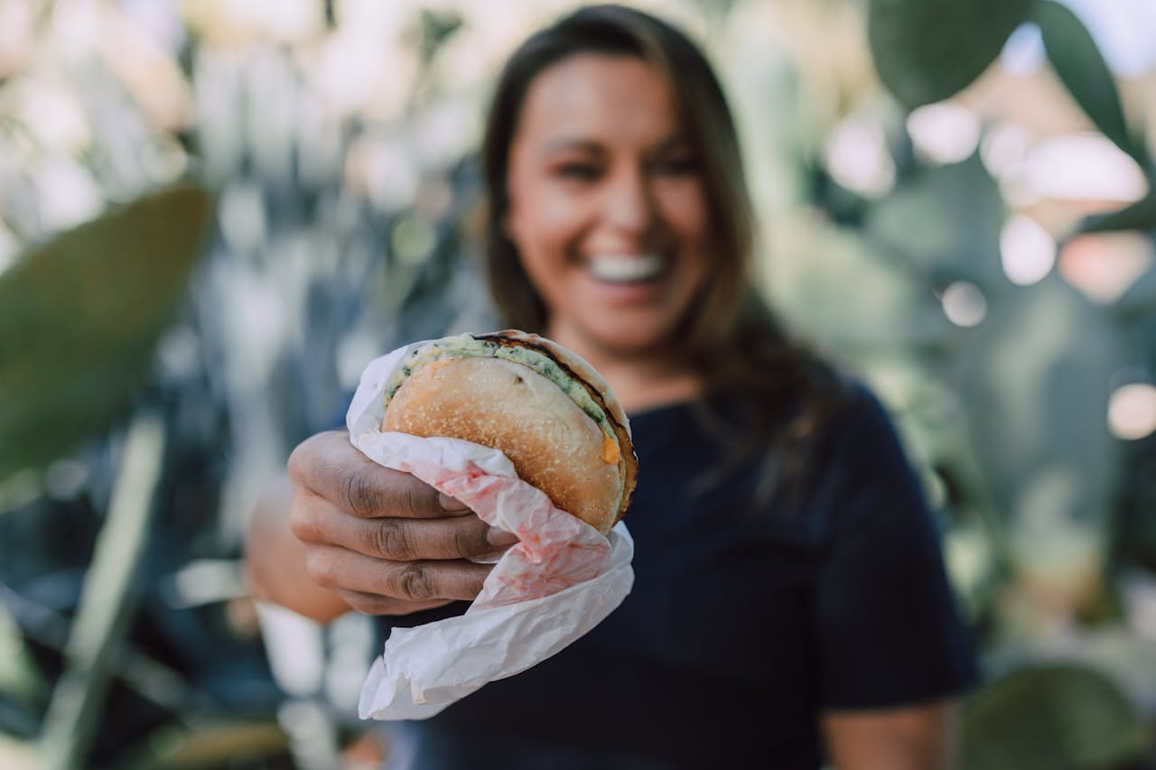 woman holding food wrapper