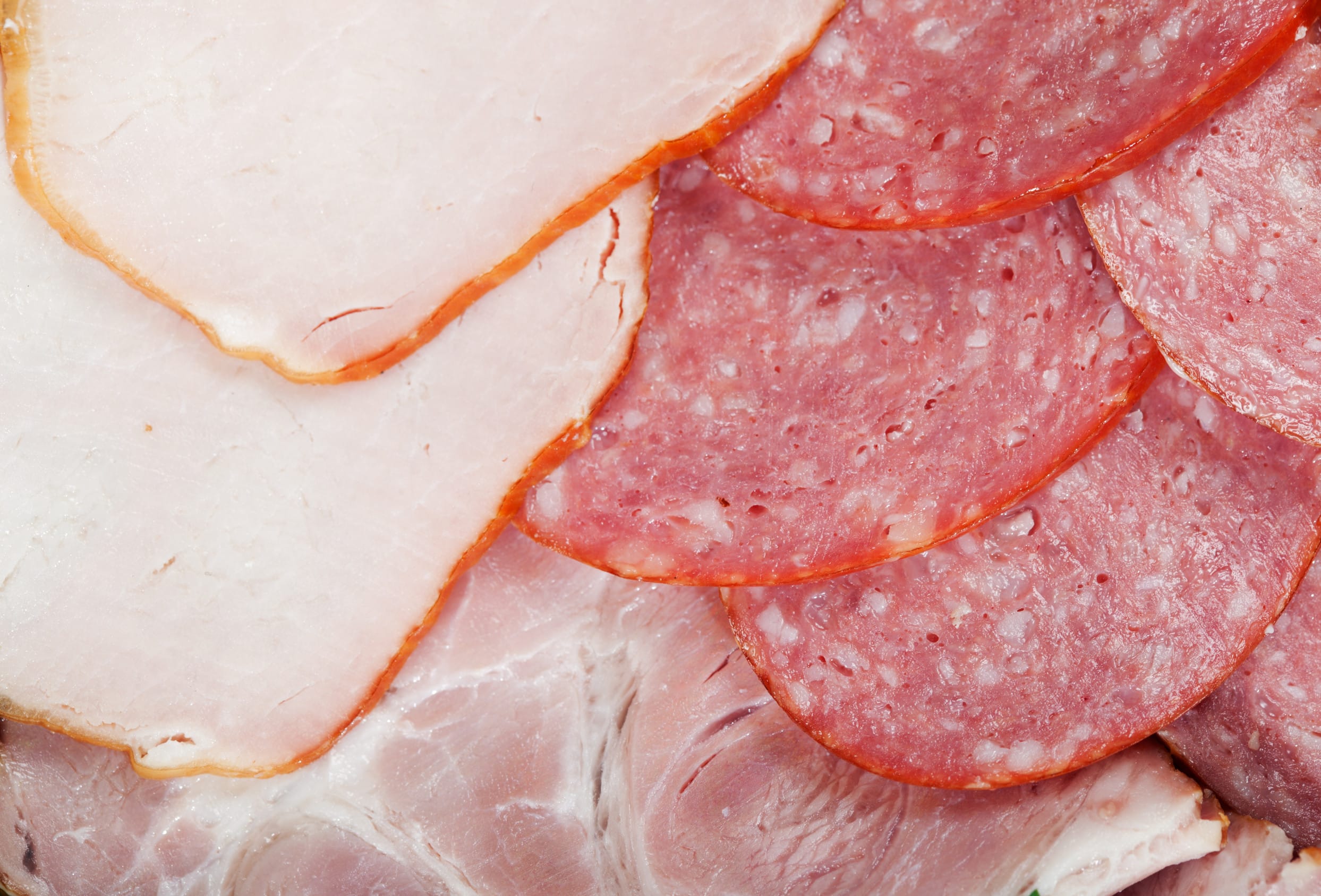 Cutting cured meat on a celebratory table expired food safety
