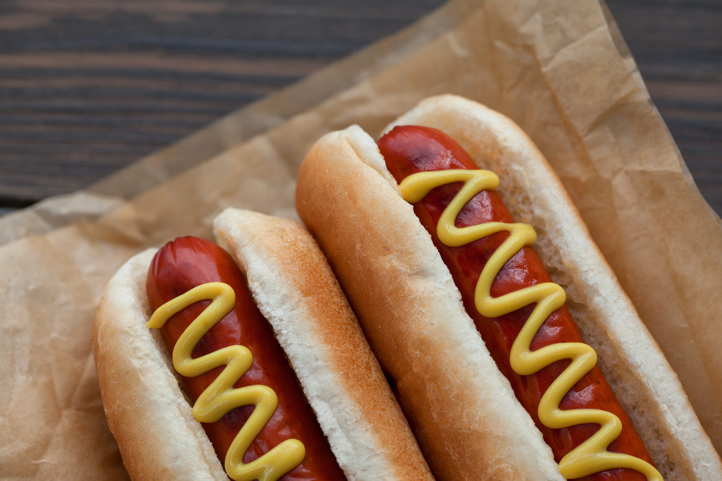 Hot dogs are a summer staple—from backyard cookouts to ballpark snacks—but not all franks are created equal. Plenty of brands sneak in fillers, preservatives, or cheap cuts that dilute quality and flavor. If you care about real ingredients and better taste, opting for hot dog brands made entirely with real meat makes a difference. These options offer transparency, nutritional value, and flavor that actually delivers. Here are eight hot dog brands that cut the junk and keep it all meat. 1. Applegate Naturals Applegate Naturals Beef Hot Dogs are among the cleanest franks out there. They’re made with 100% grass-fed beef, with few ingredients besides water, vinegar, dried vegetables, and spices. The company prioritizes regenerative sourcing practices, meaning the beef comes from farms that focus on environmental health. While the price is higher—around $8—they deliver premium, natural flavor. If you're looking for an ethical, healthy choice, Applegate Naturals is a strong pick. 2. Niman Ranch Niman Ranch hot dogs stay true to real meat—no antibiotics, fillers, or by-products allowed. These franks are nitrate-free and smoked for flavor, not preservation. The brand’s mission emphasizes humane animal treatment and sustainable farming. While the ingredient list includes minor additives like dextrose and sodium phosphate, purists still respect the near-clean profile. Great taste, better farming—Niman delivers both. 3. Hebrew National A classic favorite, Hebrew National has long built a reputation on quality. Their All-Natural Beef Franks are made with 100% kosher beef—no fillers, artificial flavors, or by-products. The brand sticks to higher standards, even long before meat quality became trendy. Known for a satisfying snap and deep flavor, they balance tradition with ingredient integrity. If you trust just one brand to deliver honest franks, Hebrew National is that one. 4. Nathan’s Famous (All-Natural Uncured) Nathan’s might be famous for Coney Island, but its All-Natural Uncured line brings serious ingredient ethics to the table. These franks are made from 100% beef, with no fillers, by-products, corn syrup, nitrates, or artificial ingredients. Free from preservatives, they offer a clean, classic hot dog taste that even food guides applaud. Nathan’s fans get nostalgia and quality in one. 5. Organic Valley / Organic Prairie These brands cater to organic-minded eaters, and they deliver. Their hot dogs are made with 100% grass-fed, pasture-raised beef or turkey, free from antibiotics, hormones, nitrates, fillers, or artificial preservatives. The result is a natural, wholesome flavor that stands out in quality. The organic label isn’t just for show—it reflects what really goes into the meat. Perfect for health-conscious families or eco-aware consumers. 6. Snake River Farms American Wagyu Looking for indulgence? This is it. Snake River Farms squeezes premium American Wagyu into hot dogs—no fillers, by-products, or artificial preservatives. Though pricey (about $12 per pack), it’s worth it for a high-end flavor experience with unmatched beef richness. For special occasions or treating yourself, these franks elevate the standard dog. 7. Boar’s Head Uncured Beef Frankfurters A go-to deli staple, Boar’s Head offers top-tier quality in frankfurter form. Made with 100% USDA Choice beef, these uncured franks lack fillers and stick to simple, traditional ingredients. Beefy, slightly smoky, and with a natural snap, they’re indulgent yet honest. This brand delivers depth of flavor without the garbage. 8. Kirkland Signature (Costco) Costco’s in-house Kirkland hot dogs aren't just cheap—they’re surprisingly clean. These dogs use 100% beef, maintaining a juicy, flavorful experience that matches their food court legacy. With USDA Choice cuts and tight quality control via Costco’s own plants, they punch above their price. If you love Costco’s hot dog combo, you’ll love knowing your franks are all meat. Why These Hot Dog Brands Stand Out From frugal to gourmet, each of these hot dog brands prioritizes real meat, transparent ingredients, and flavor that earns its keep. Whether you're raising the bar on quality, reducing artificial nasties from your plate, or simply craving better taste—these brands deliver. From grass-fed to Wagyu, kosher to organic—there’s a clean dog out there for every preference and budget. Which of these hot dog brands are you most excited to try—or already love? Drop your favorites in the comments and let's get a debate going! You May Also Like... Elevate Your BBQ: 12 Cookout Dishes That Aren’t Burgers or Hot Dogs 5 Mistakes You’re Making When Grilling Hot Dogs What Makes A Really Great Burger? Americans Weigh In 7 Popular Hot Dog Brands You Shouldn’t Put On Your Grill This Season The Costco $1.50 Hotdog and Drink Meal—Why The Price Will Never Change