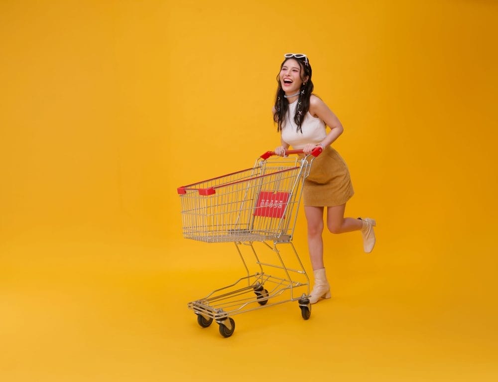 Full,Length,Happy,Excited,Asian,Teen,Woman,Pushing,Empty,Shopping 6 Cart Habits That Reveal You're an Impulse Shopper